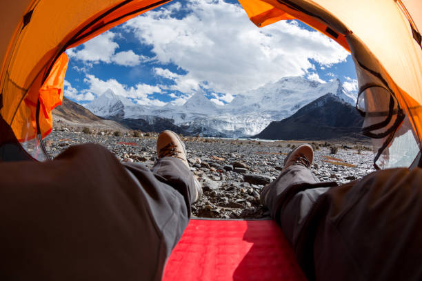 istock Hiker enjoy the beautiful landscape in tent 1288971915