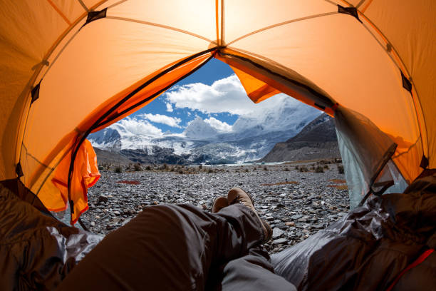 istock Hiker enjoy the beautiful landscape in tent 1288973824