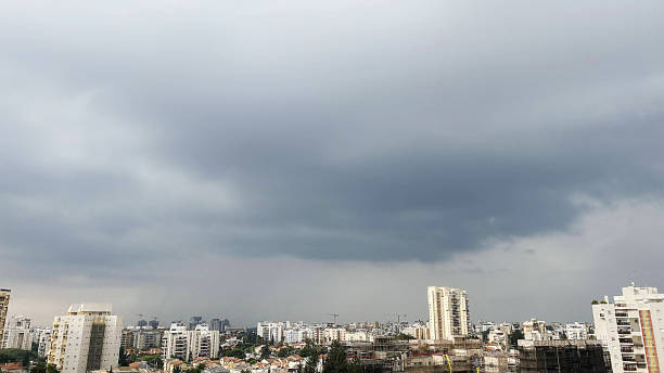 istock Cloudy sky over the city. the storm is coming 1288974881