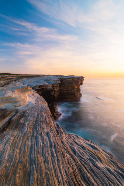 istock Sunrise by the cliff 1288975750