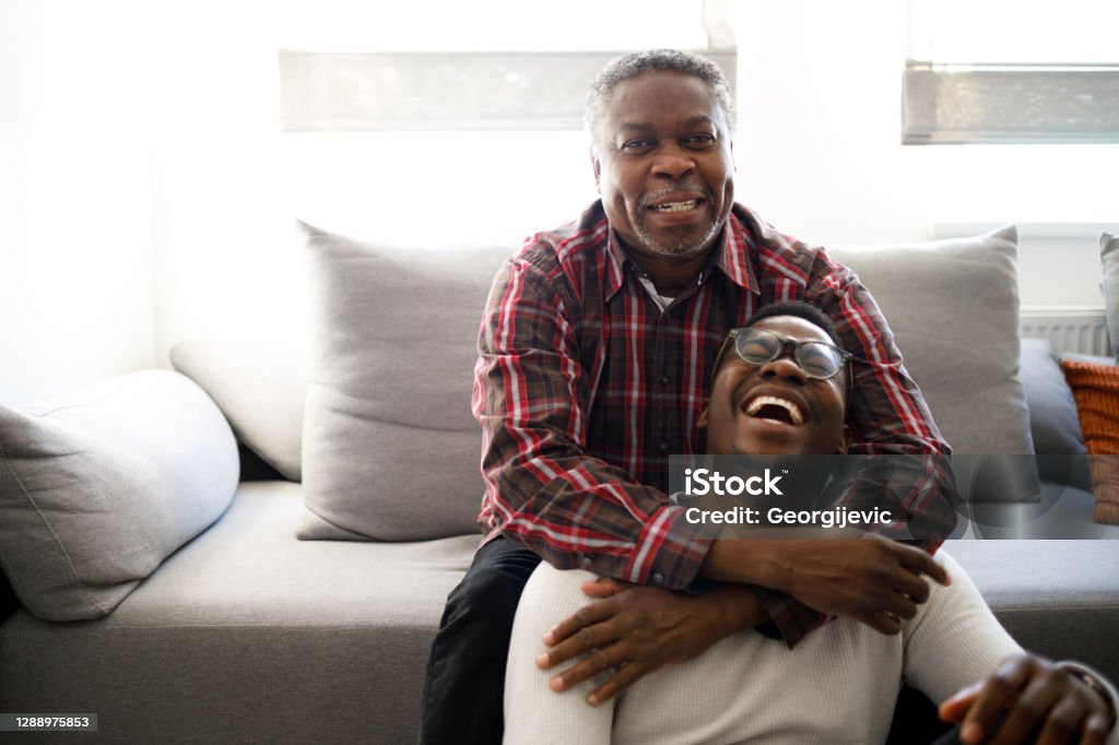 Father and son 60 years old man is having a moment with his son. Father's Day Stock Photo