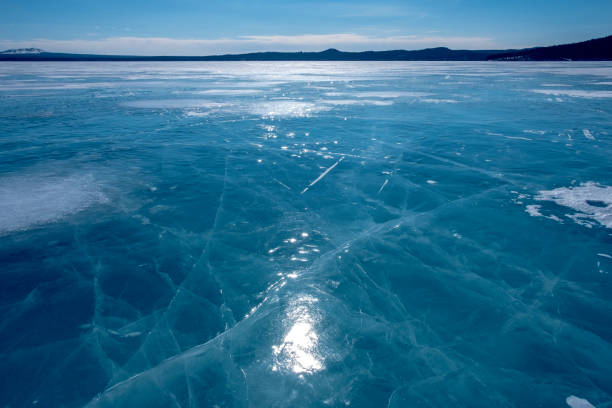 istock Cracks on ice. Frozen lake. 1288976373