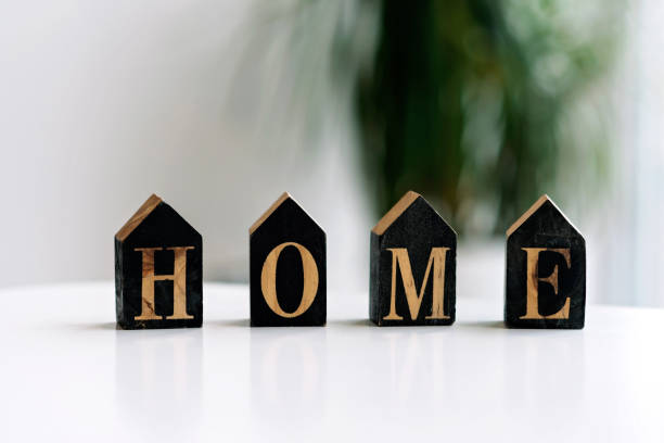 istock Home concept, inscription on wooden cubes home. Soft selective focus. 1288980197