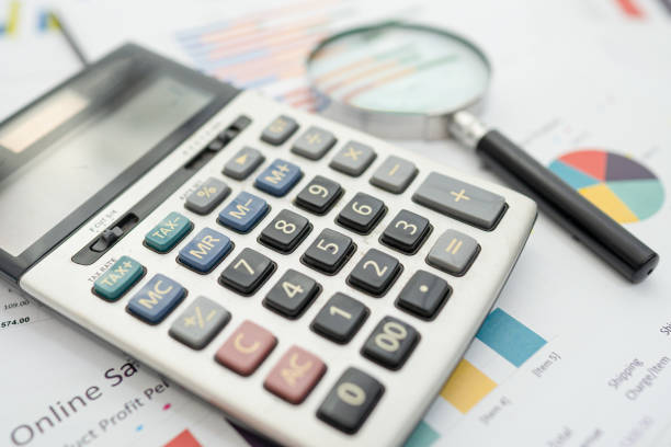 istock Calculator on chart and graph paper. Finance development, Banking Account, Statistics, Investment Analytic research data economy, Stock exchange trading, Business company concept. 1288981152