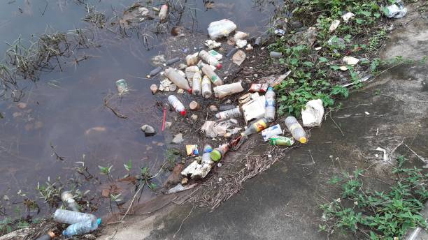 istock 2 December 2020,Garbage and plastic bottles floating on ditch,Songkhal,Thailand. 1288982730