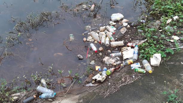 istock 2 December 2020,Garbage and plastic bottles floating on ditch,Songkhal,Thailand. 1288982731