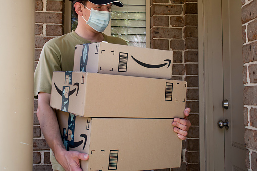Sydney, Australia - 2020-11-29 Amazon prime boxes and delivered to a front door of residential building during the COVID-19 pandemic.