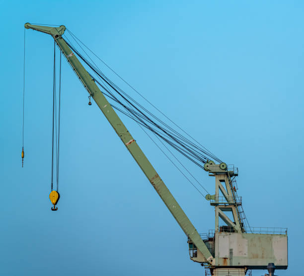 istock Large and old industrial heavy lift crane at a shipyard. 1288985543