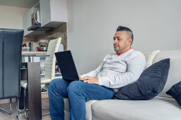 istock Man working at home on his laptop 1288985839