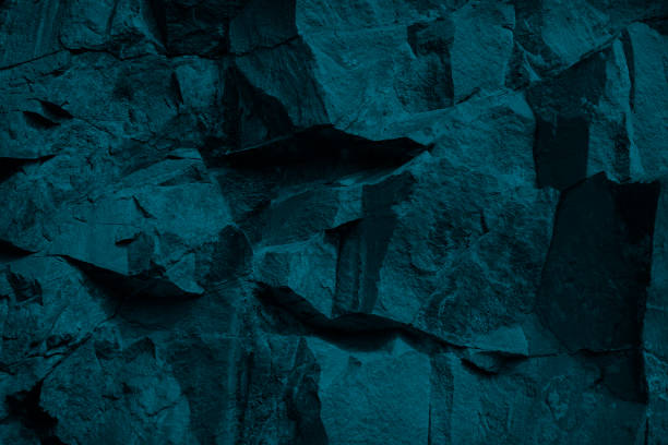 istock Blue green modern stone background. Monochrome toned rock texture background. 1288989843