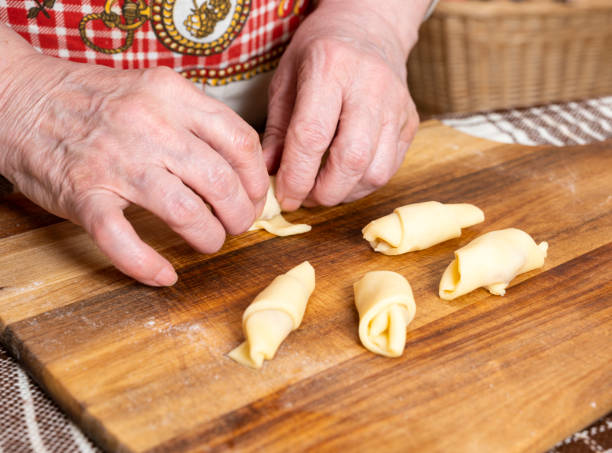 istock Woman preparing homemade rolls with jam  at home 1288990248