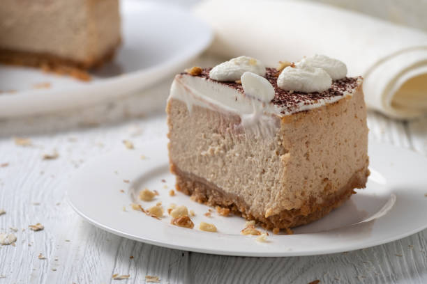istock Delicious cheesecake with cream cheese and cocoa. 1288992405