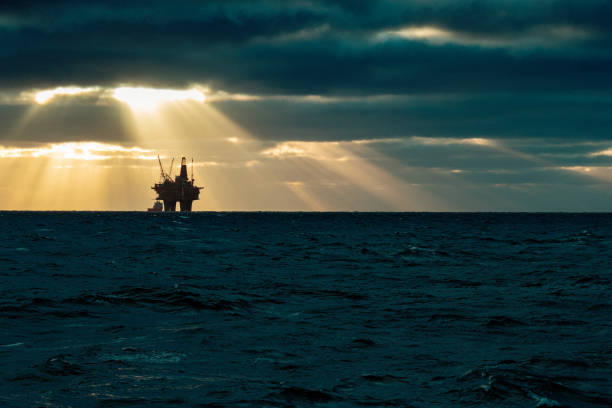 Industrial oil rig offshore platform: away from a sustainable resource Industrial oil rig offshore platform construction site on the North Seacoast north sea oil and gas stock pictures, royalty-free photos & images