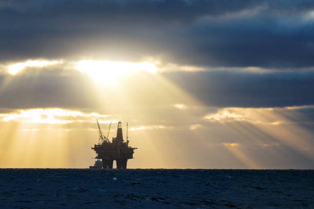 Industrial oil rig drilling offshore platform construction site on the North Sea coast Industrial oil rig offshore platform construction site on the North Seacoast north sea oil and gas stock pictures, royalty-free photos & images