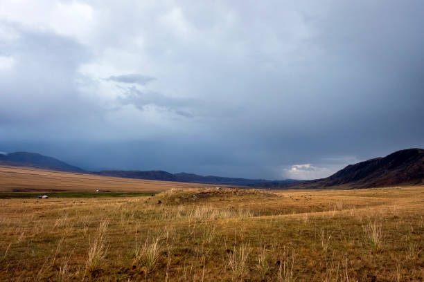 istock Mountain plateau with ancient mound and cloudy blue sky on background. Rural scenery. Summer nature landscape. Borokhudzir plateau, Kazakhstan. Tourism in Kazakhstan concept. 1288995759