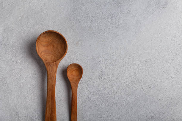 istock Wooden spoons on a light background 1288996322