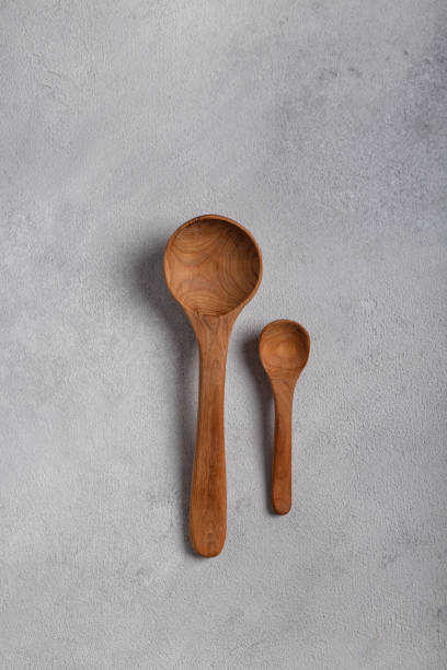 istock Wooden spoons on a light background 1288996351