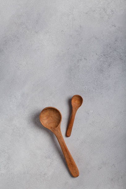 istock Wooden spoons on a light background 1288996374