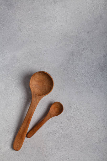 istock Wooden spoons on a light background 1288996381