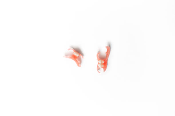 istock Dental prosthetics on a white background. Dentures. Dentistry. Prosthetic teeth. Dental plates. Artificial teeth. Prosthetic dentistry. Set of dentures on a white background. Copy space 1288997674