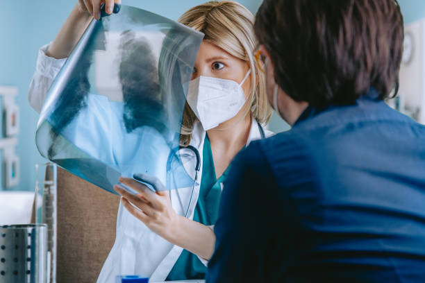 istock Doctor and patient sitting in doctor's office 1288999718