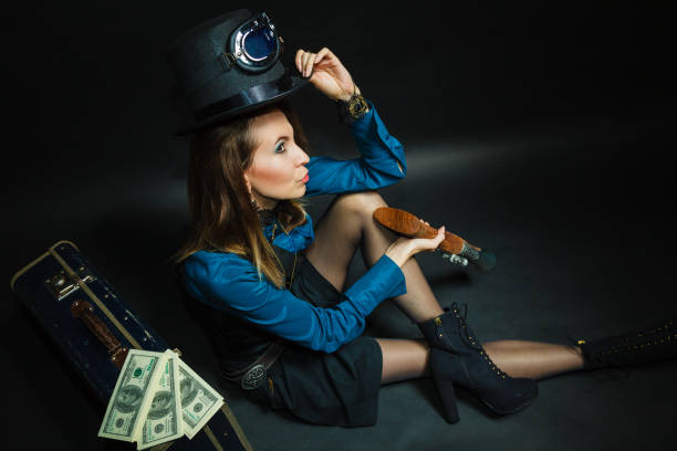 istock Steampunk girl with cash. 1289000439