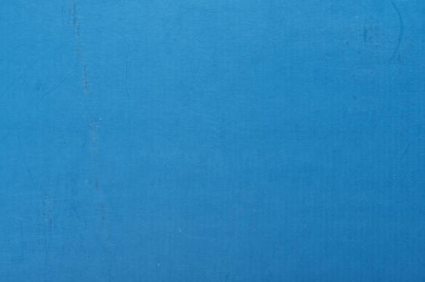 istock Old scratched blue cardboard background 1289000922