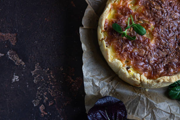 istock Homemade chicken, mushroom and potato open pie or quiche, dark rustic concrete background. French cuisine. Top view. 1289003503