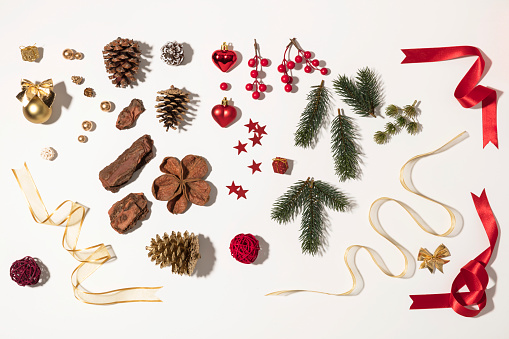 Christmas background. Christmas balls, fir tree branches and christmas ornament on white background