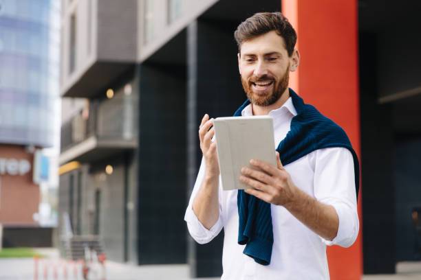 istock Male entrepreneur having video call on digital tablet 1289005338