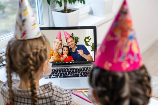 istock kids having web chat call conference. Remote congratulation of children using Internet technologies. 1289007887