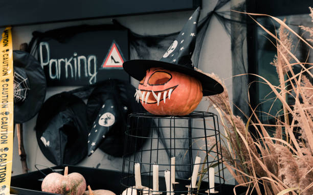 istock pumpking head parked over cage with candles 1289011086
