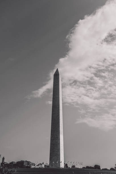 istock Low Angle View Of Building Against Cloudy Sky 1289011293