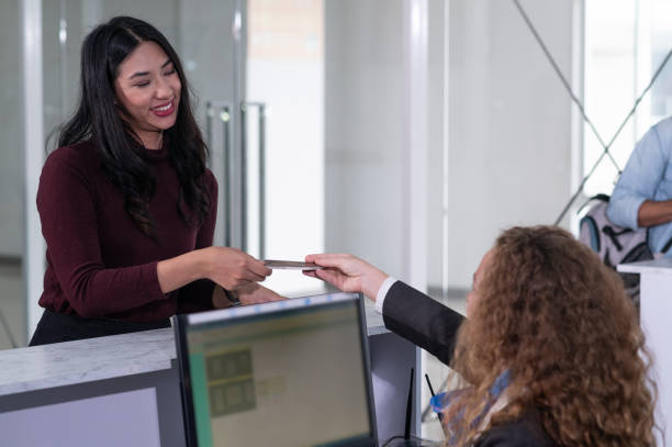 istock Airline passengers checking in at airline counter. 1289012874