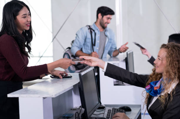 istock Airline passengers checking in at airline counter. 1289012875