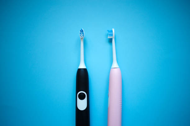 istock two ultrasonic electric toothbrushes on a blue background 1289014915