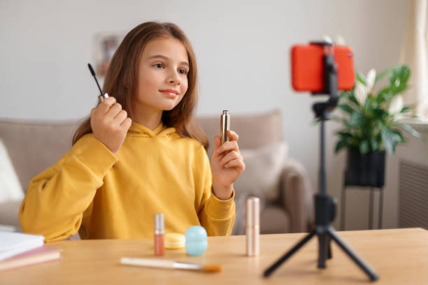 istock Young beauty blogger shooting vlog at home 1289014941