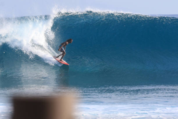 istock Casual Surfer on a red board 1289015265