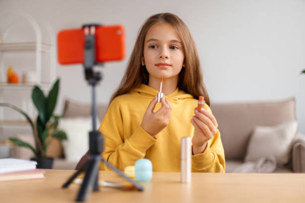 istock Young girl recording vlog about makeup at home 1289016814