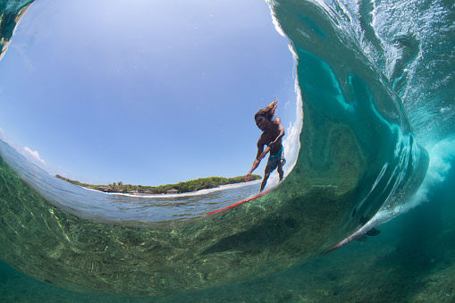 A fisheye view of a local surfer in the Maldives