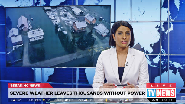 Female anchor presenting breaking news about severe weather causing power outage