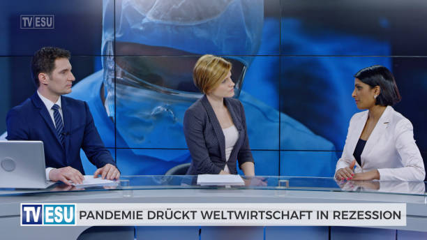 istock Anchors and co-anchor discussing about global recession 1289018025