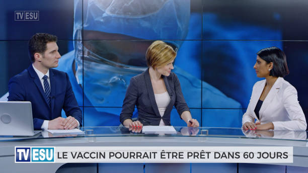 istock Anchors and co-anchor discussing about vaccine accessibility 1289018032