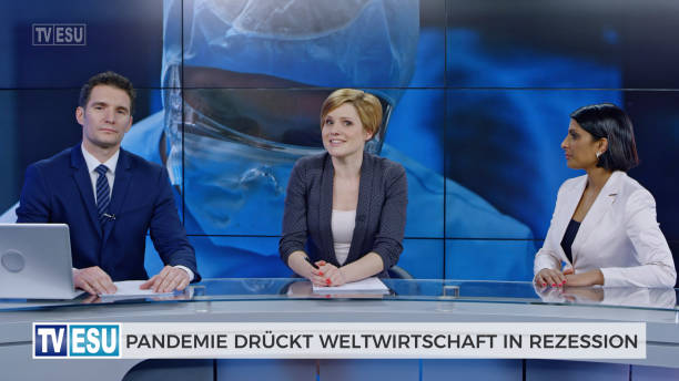 istock Anchors and co-anchor discussing about global recession 1289018088