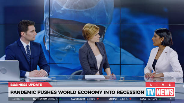 istock Anchors and co-anchor discussing about global recession 1289018103