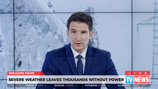 Male anchor presenting breaking news about severe weather causing power outage
