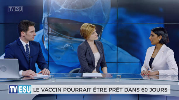 istock Anchors and co-anchor discussing about vaccine accessibility 1289018109