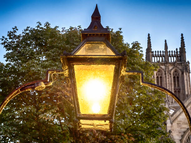 istock Lit Victorian style street lamp, Leeds, West Yorkshire, England, Britain 1289020785