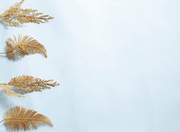 istock christmas background with light  gold leaves ornaments 1289020884
