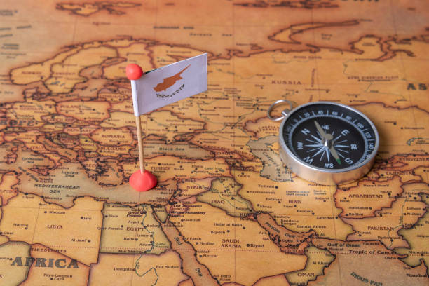 istock Cyprus flag and compass on the world map. 1289021234